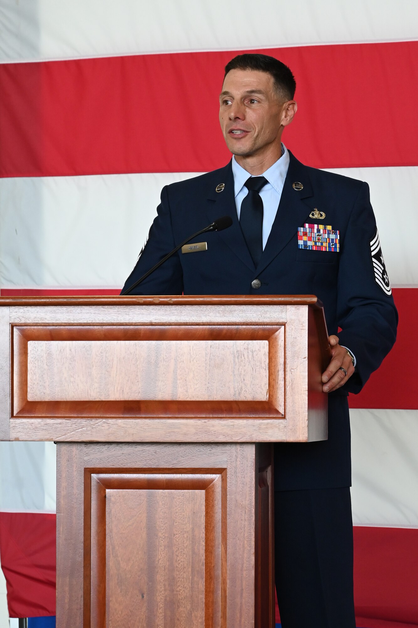 U.S. Air Force Command Chief Master Sgt. Charles Hansel addresses the audience Sept. 26, 2025 during a change of Authority ceremony at the Springfield-Beckley Air National Guard base in Springfield, Ohio. The ceremony signified the transfer of authority and responsibility from one command chief to the next. (U.S. Air National Guard photo by Shane Hughes)