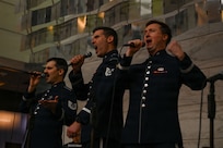 U.S. Air Force Tech. Sgt. Ben Edquist, left, Tech. Sgt. Michael Aiello, center, and Tech. Sgt. Adam von Almen, all vocalists with The U.S. Air Force Band’s Singing Sergeants, sing a selection at the Smithsonian National Museum of American History in Washington, D.C., March 12, 2026. The U.S. Air Force Band vocalists performed while accompanied by a piano, a guitar, and drums. (U.S. Air Force photo by Airman 1st Class Brandon Thomas)