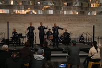 U.S. Air Force Tech. Sgt. Adam von Almen, left, Tech. Sgt. Ben Edquist, center, and Tech. Sgt. Nicole Vander Does, all vocalists with The U.S. Air Force Band’s Singing Sergeants, perform a selection at the Smithsonian National Museum of American History in Washington, D.C., March 12, 2026. The U.S. Air Force Band performed a multitude of songs as a part of a celebration leading up to the 250th birthday celebration of the United States. (U.S. Air Force photo by Airman 1st Class Brandon Thomas)