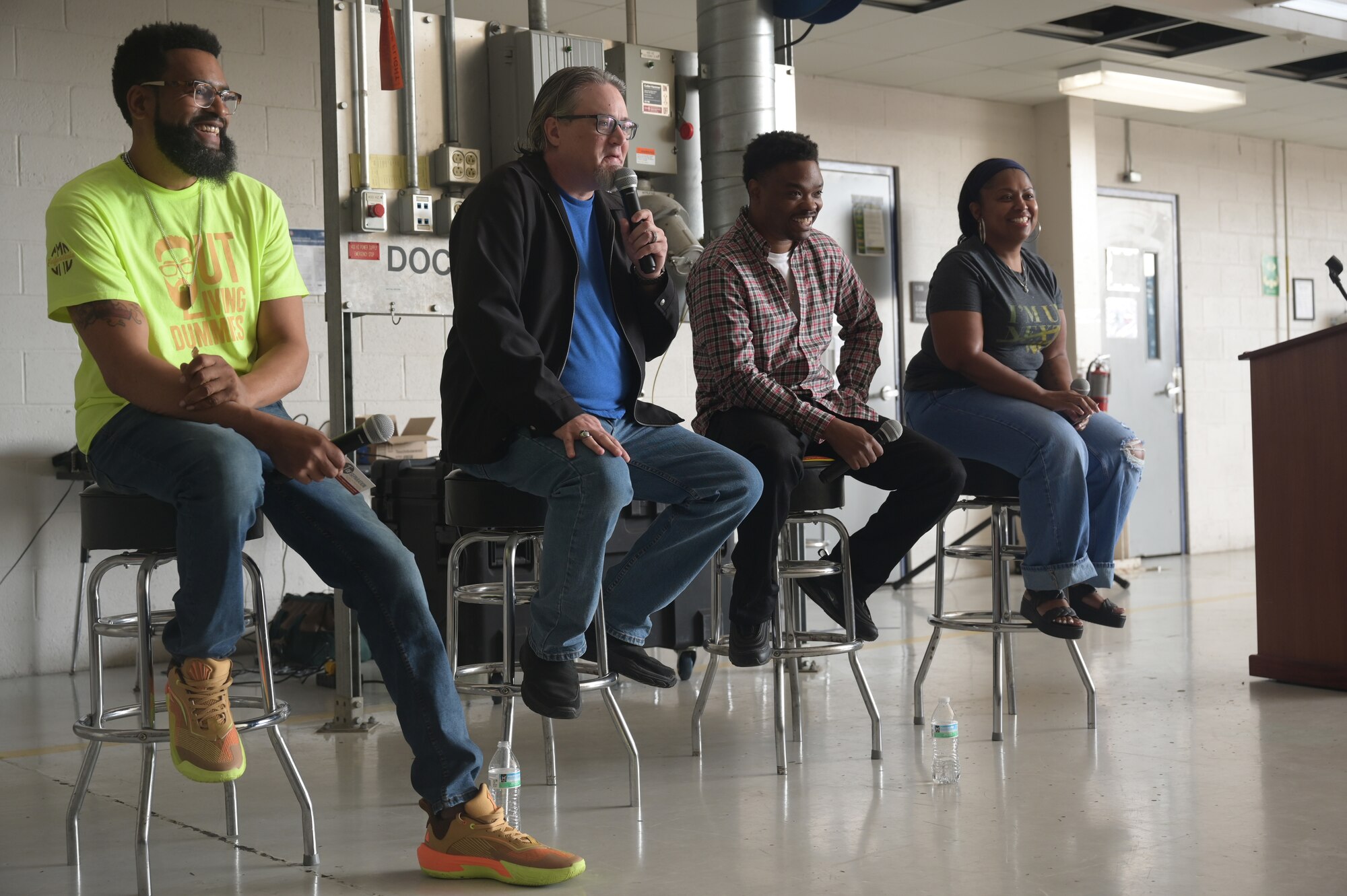 (From left) Jermaine Wiley, Jason Ressler, Neff Johnson, and Roni Shanell, comedians with One Degree of Separation, speak about their struggles with mental health Sept. 17, 2025 to an audience of airmen of the 178th Wing  at the Springfield Air National Guard Base in Springfield, Ohio. They visited the wing to talk to the airmen about mental health and suicide prevention. (U.S. Air Force photo by Shane Hughes)
