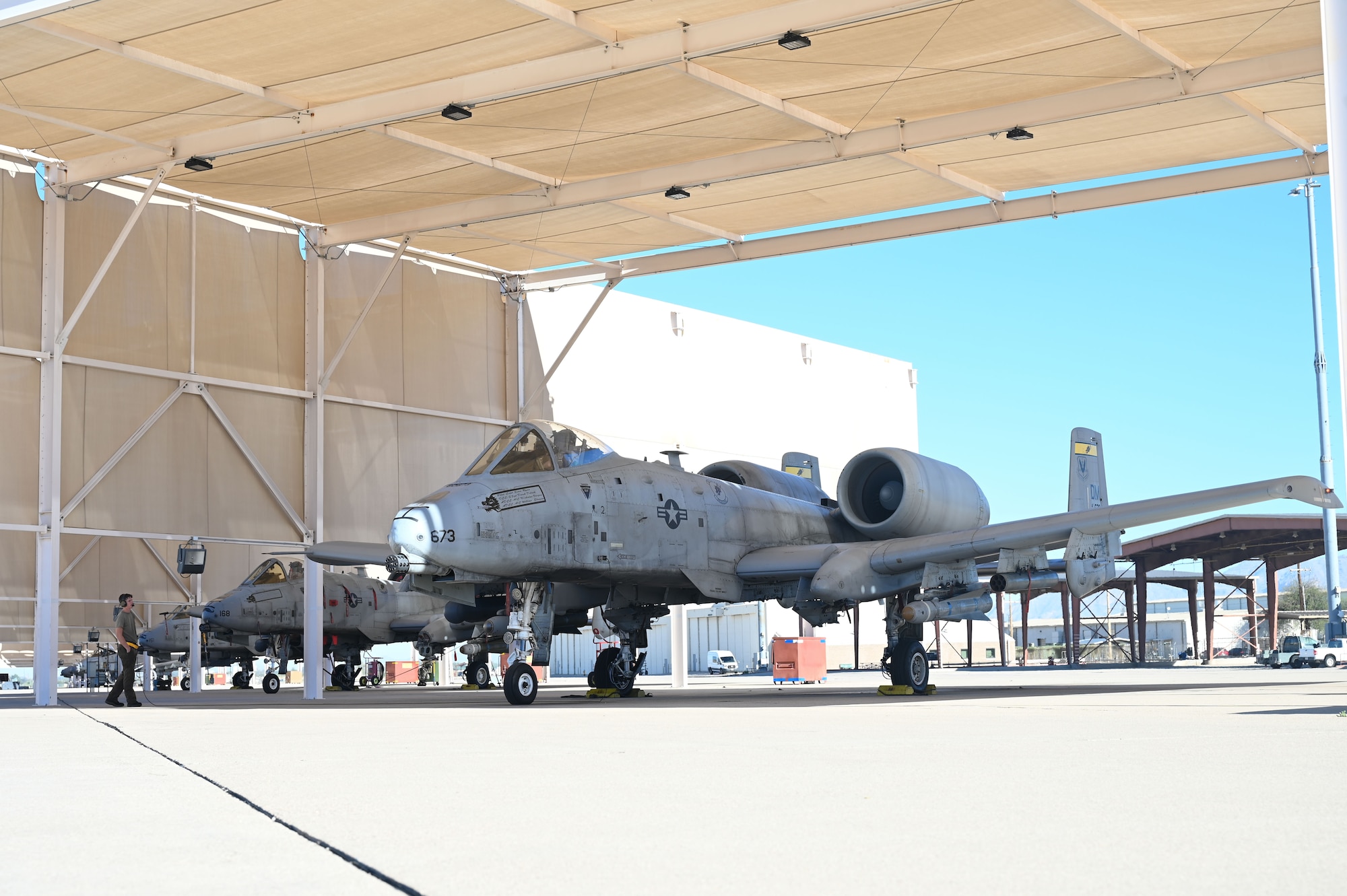 U.S. Air Force Airman 1st Class Jonathon Mitchell, 357th Fighter Generation Squadron assistant dedicated crew chief, left, and 1st Lt. Hunter Mason, a 357th Fighter Squadron A-10C Thunderbolt II pilot, right, complete the final safety checks before taking off at Davis-Monthan Air Force Base, Arizona, March 18, 2026. Mason participated in a close air support exercise as part of his mission qualification training. (U.S. Air Force Photo by Airman 1st Class Jaden Kidd)