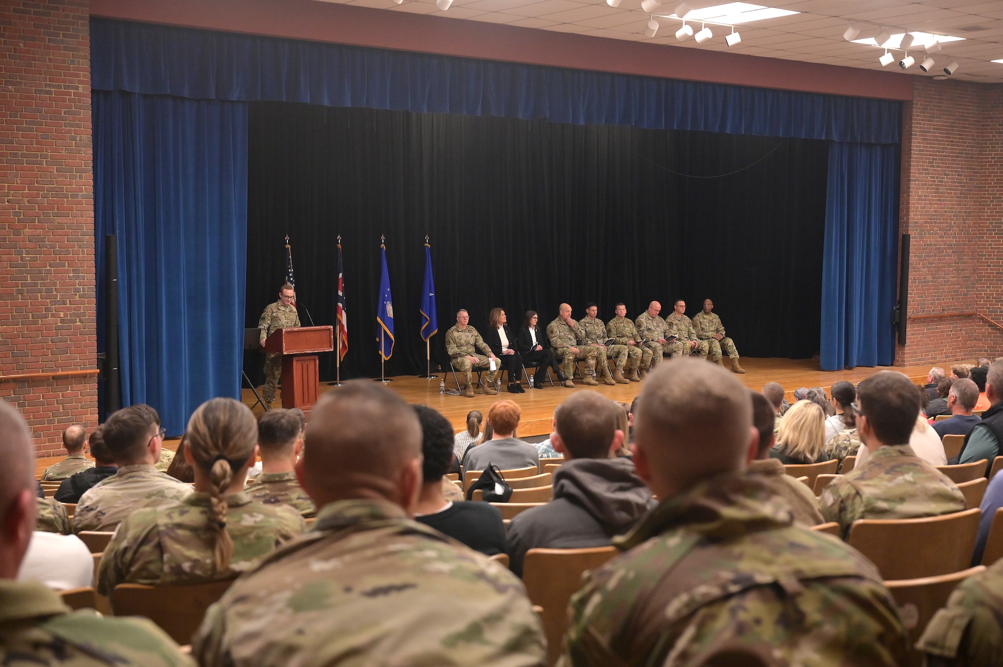Airmen assigned to the 123rd Air Control Squadron and their families attend a homecoming ceremony Dec. 7, 2025 in the auditorium at Muntz Hall at the University of Cincinnati campus in. Blue Ash, Ohio. Nearly 300 airmen assigned to the 123rd Air Control Squadron returned home from a six-month deployment supporting U.S. Air Forces Central Command. (U.S. Air Force photo by Shane Hughes)