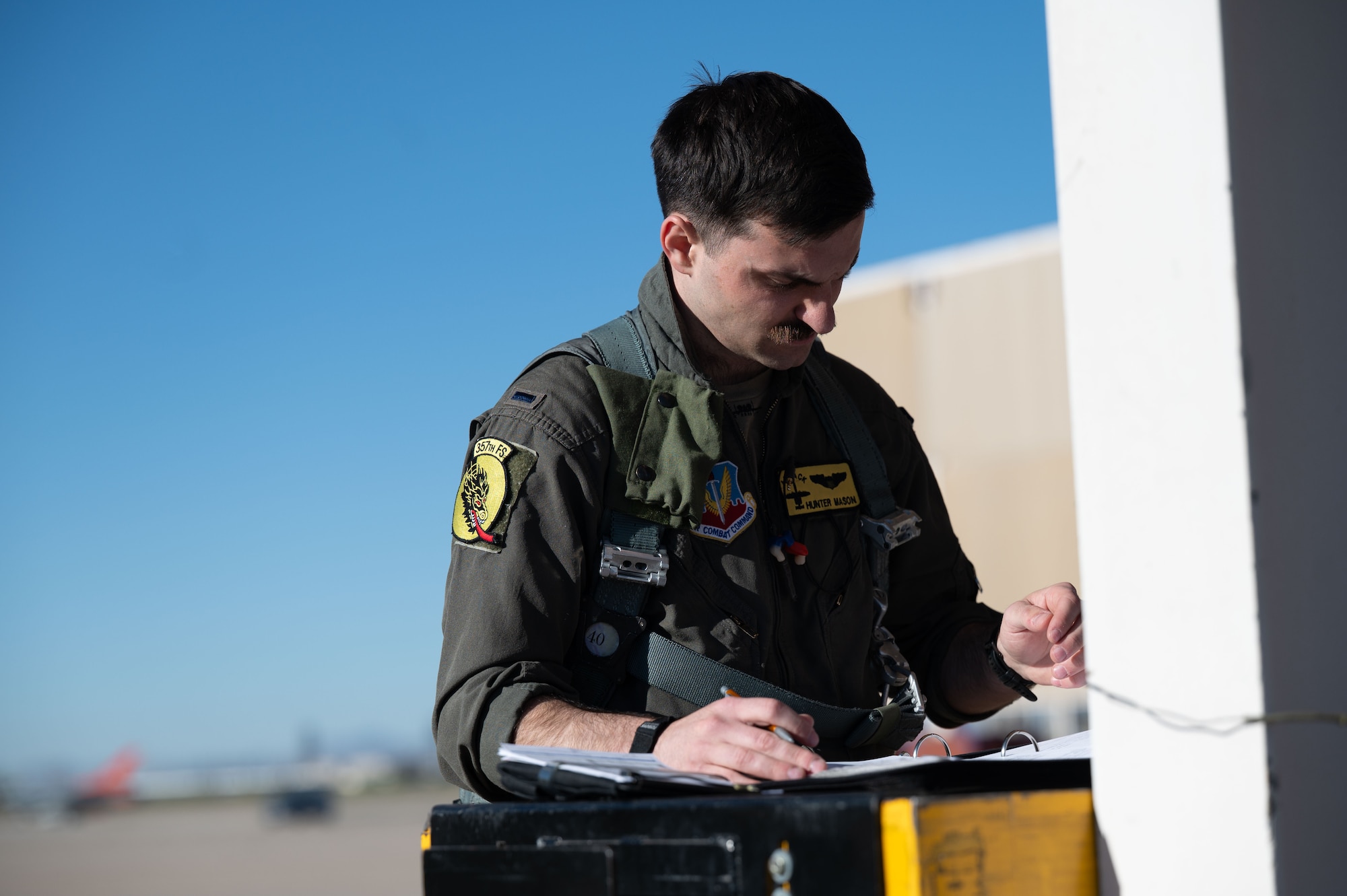 U.S. Air Force 1st Lt. Hunter Mason, a 357th Fighter Squadron A-10C Thunderbolt II pilot, performs preflight checks prior to the final training exercise on Davis-Monthan Air Force Base, Arizona, March 18, 2026. Mason was preparing for the final flight exercise needed to complete his mission qualification training. (U.S. Air Force photo by Airman Najzee Kuzu)