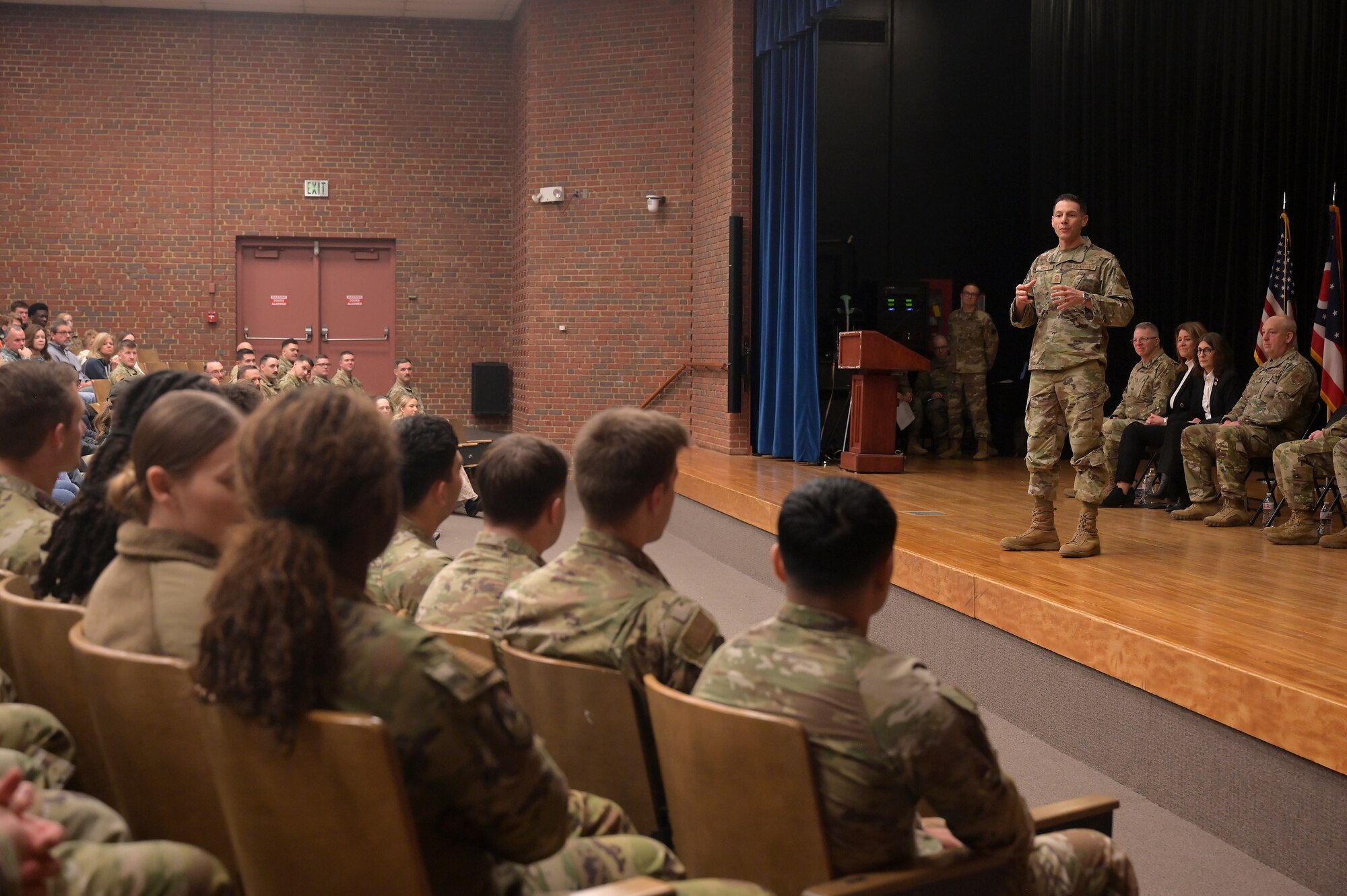U.S. Air Force Command Chief Master Sgt. Charles Hansel, command chief of the 178th Wing, speaks to the airmen of the 123rd Air Control Squadron during a homecoming ceremony Dec. 7, 2025 in the auditorium at Muntz Hall at the University of Cincinnati campus in. Blue Ash, Ohio. Nearly 300 airmen assigned to the 123rd Air Control Squadron returned home from a six-month deployment supporting U.S. Air Forces Central Command. (U.S. Air Force photo by Shane Hughes)