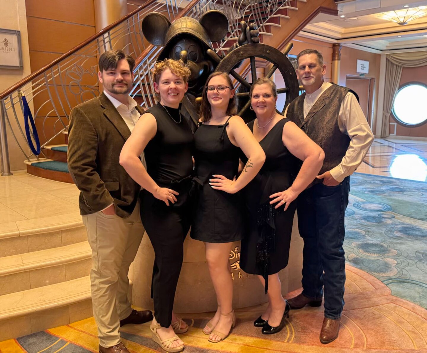 Picture of a family in front of stairs.