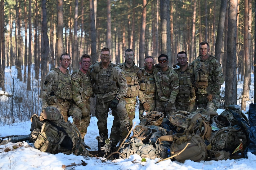 An eight-person squad with the Pennsylvania Army National Guard team stand together for a photo while participating in the Lithuanian Land Forces Best Infantry Squad Competition in Rukla, Lithuania, March 4, 2026. Pennsylvania Army Guard Soldiers placed second among foreign teams during the multinational competition.The Pennsylvania National Guard and Lithuania have been partners in the Department of Defense National Guard State Partnership Program since 1993, conducting joint training and exchanges that strengthen military cooperation and interoperability. (U.S. Army National Guard photo by Sgt. 1st Class Amber Peck)