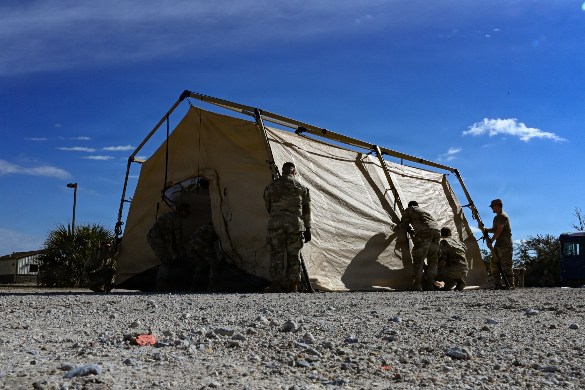 U.S. Air Force medics assigned to the 31st Combat Air Base Squadron establish an air transportable clinic during the 31st Air Task Force’s second field training exercise at Tyndall Air Force Base, Florida, Feb. 7, 2026. The facility, easily palletized and shipped as cargo, is an Air Force medical capability containing defibrillators, ventilators, and EKGs as well as an array of medicine and other supplies. (U.S. Air Force photo by Senior Airman Ty Pilgrim)