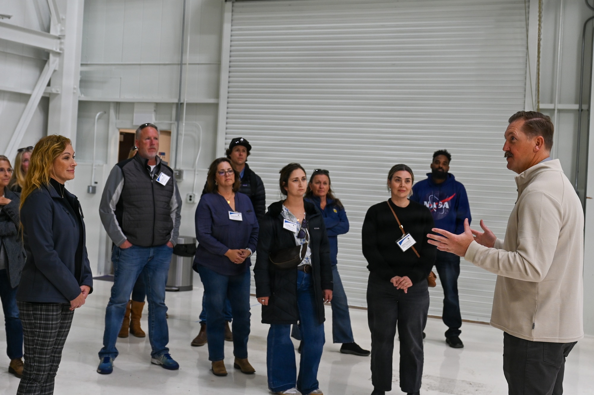 Daye Hoffman, NASA Launch Service Program’s organizational director at Vandenberg, gives a tour to the Santa Maria Chamber of Commerce, inside NASA’s LSP Clean Room.