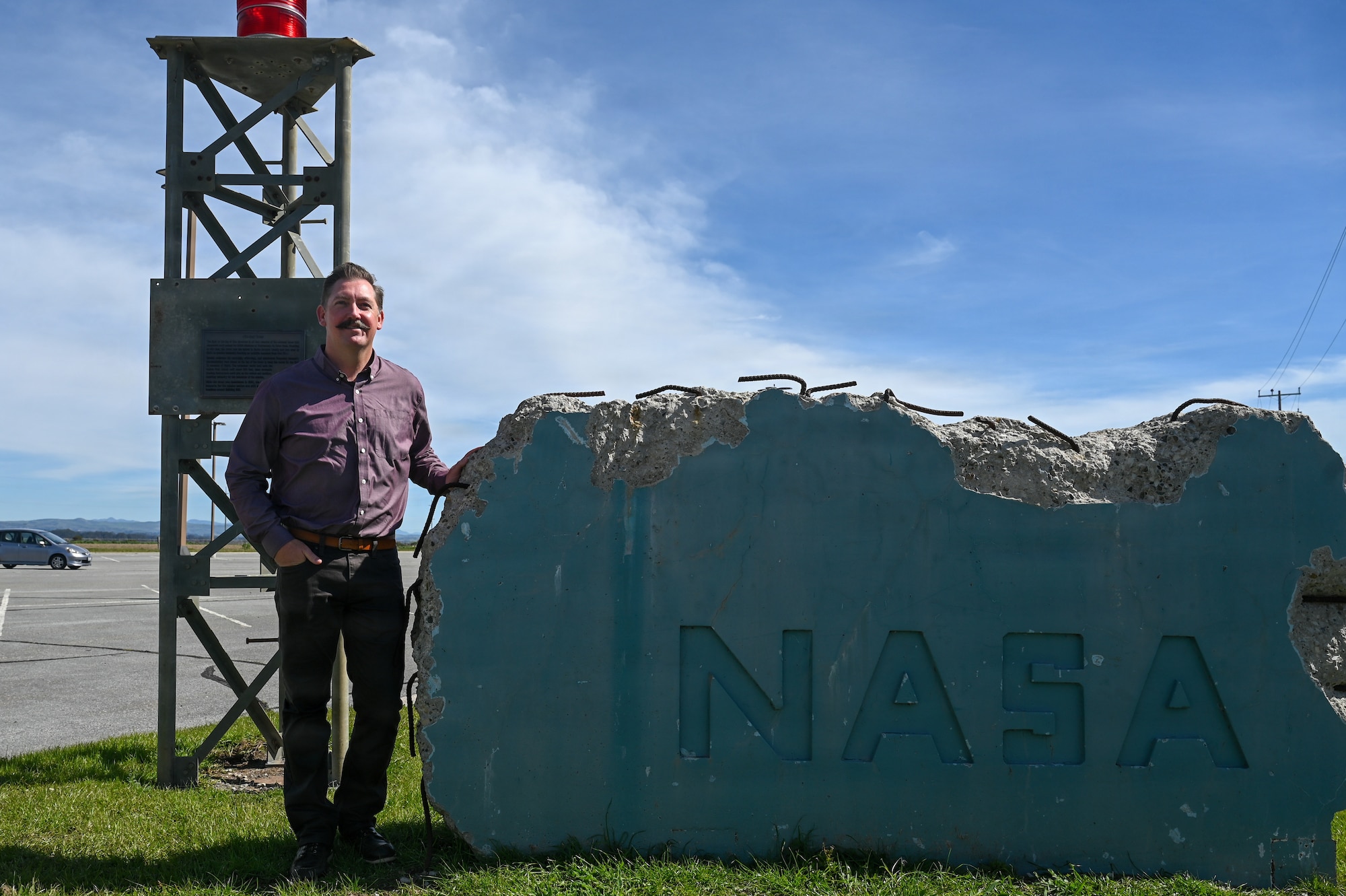 Daye Hoffman, NASA Launch Service Program’s organizational director at Vandenberg, stands for a portrait photo at the entrance of NASA’s campus.