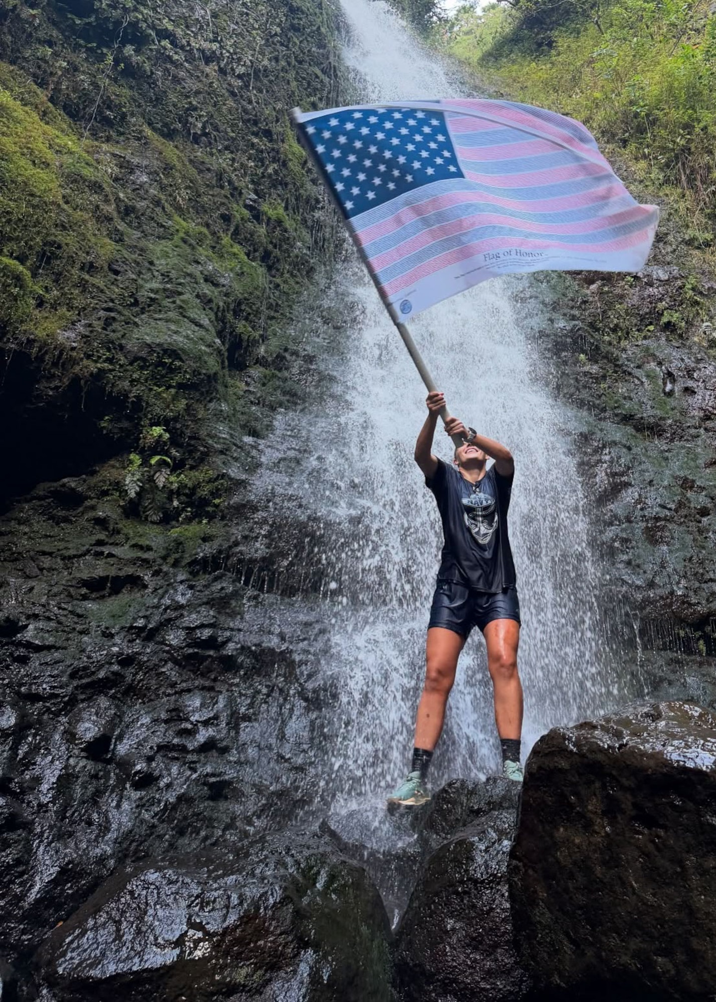 Born waves the "Flag of Honor" in Hawaii.