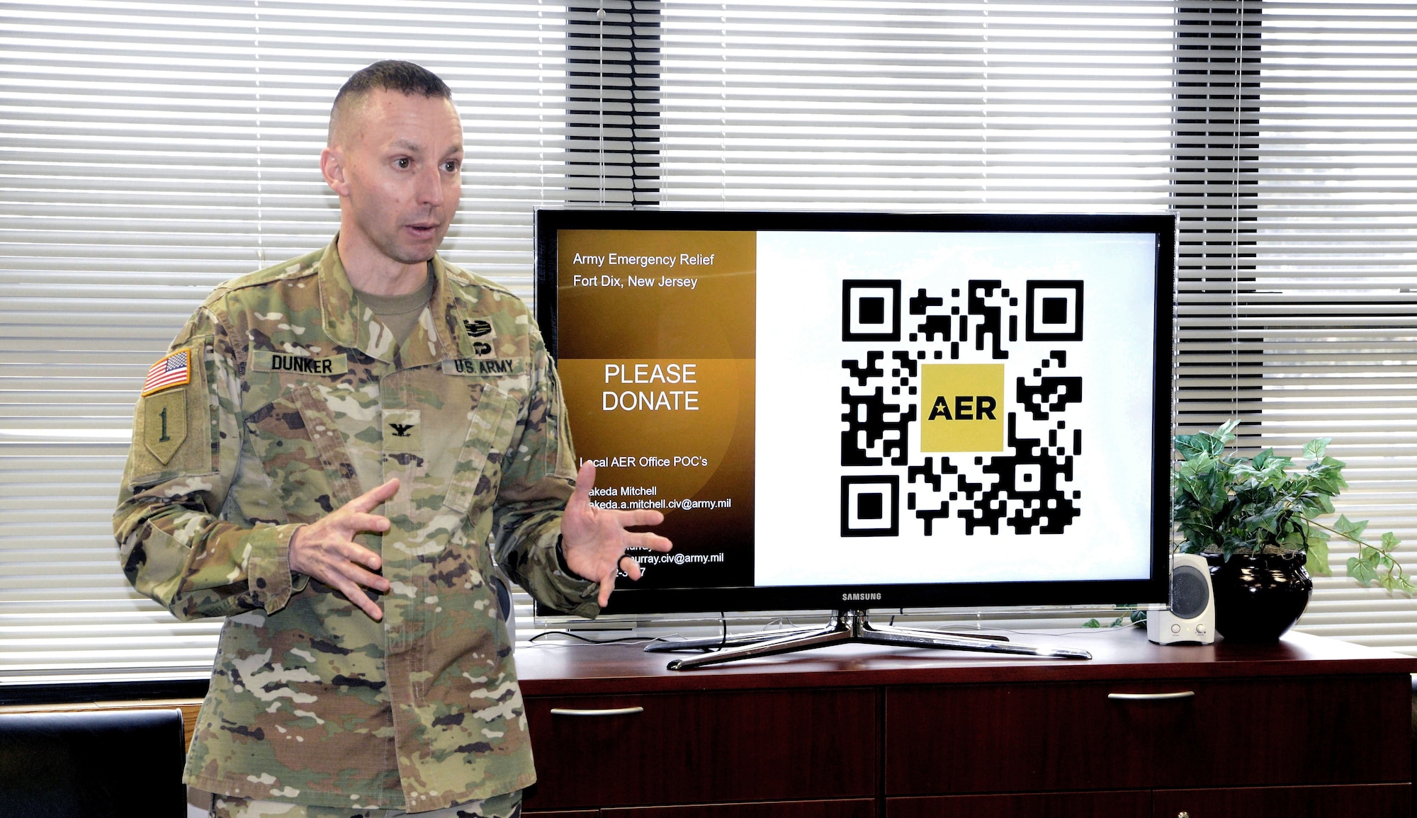 U.S. Army Col. Bryan Dunker, JB MDL deputy commander and U.S. Army Support Activity Fort Dix commander, highlights how small acts of generosity make a big difference during the Army Emergency Relief campaign kick-off ceremony at JB MDL, N.J., March 5, 2026. Founded in 1942, AER is the Army’s official nonprofit organization which provides financial assistance to Soldiers and their families during financial hardship through donations. (U.S. Air Force photo by Kris Patterson)