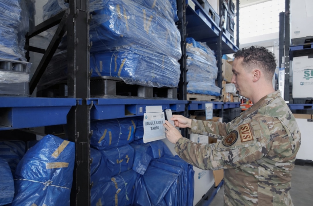 U.S. Air Force Master Sgt. Christian Ortiz Morales, Defense POW/MIA Accounting Agency Europe-Mediterranean Detachment superintendent, uses the detachment’s new QR code inventory system at the warehouse in Miesau, Germany, March 18, 2026.