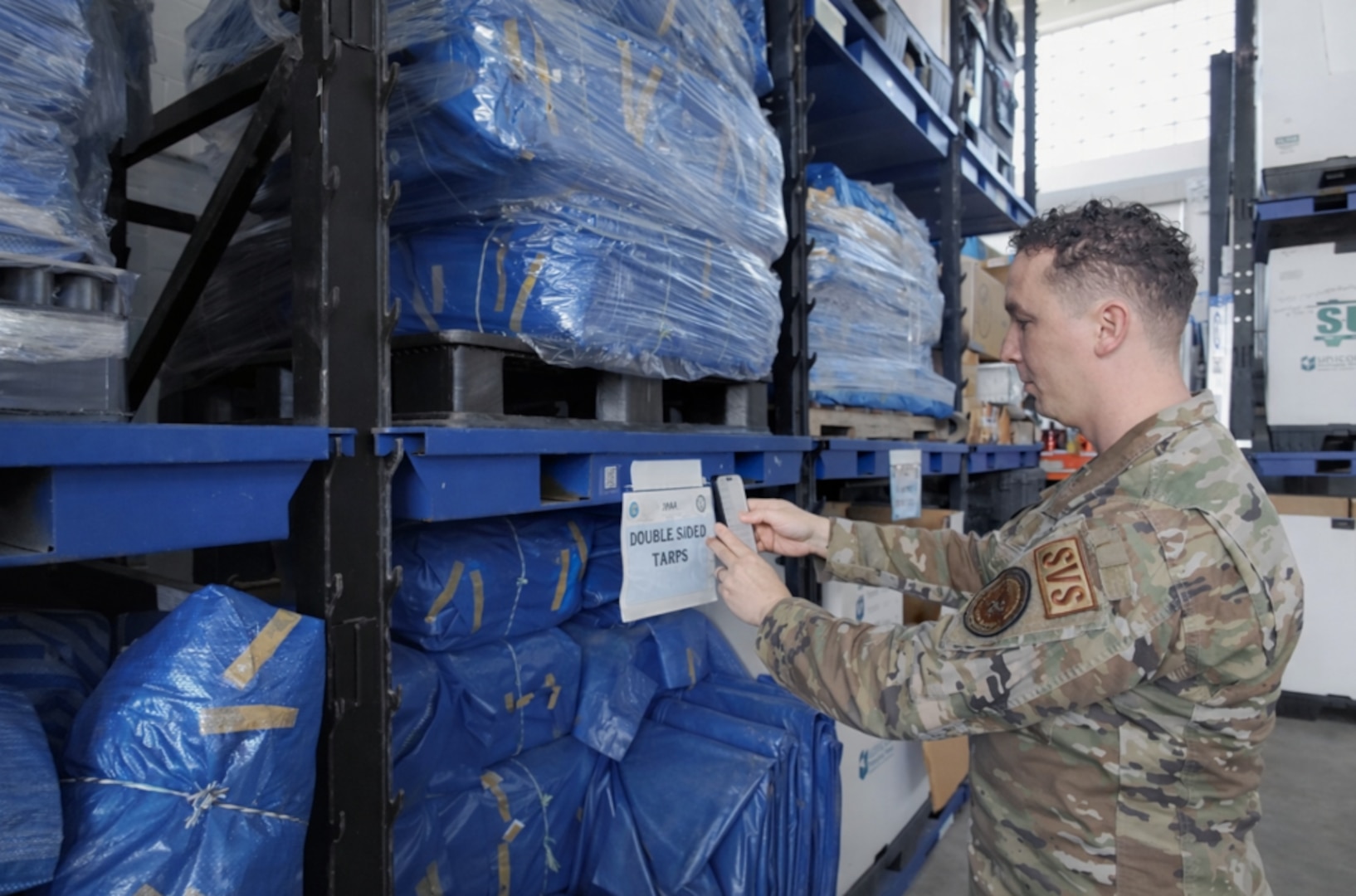U.S. Air Force Master Sgt. Christian Ortiz Morales, Defense POW/MIA Accounting Agency Europe-Mediterranean Detachment superintendent, uses the detachment’s new QR code inventory system at the warehouse in Miesau, Germany, March 18, 2026.