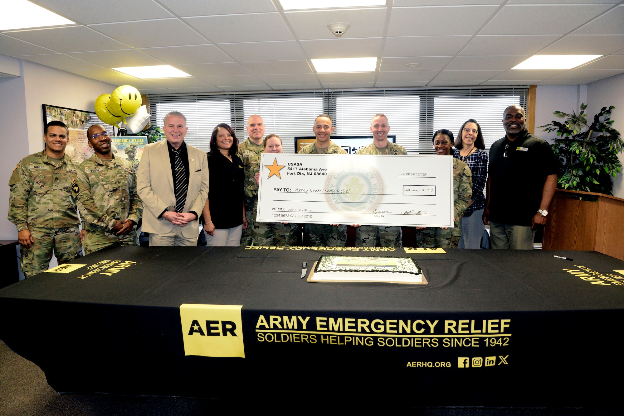 Leaders from U.S. Army Support Activity Fort Dix unite with members of the USASA Army Emergency Relief team to kick-off the 2026 AER campaign at Joint Base McGuire-Dix-Lakehurst, N.J., March 5, 2026. Founded in 1942, AER is the Army’s official nonprofit organization which provides financial assistance to Soldiers and their families during financial hardship through donations. (U.S. Air Force photo by Kris Patterson)
