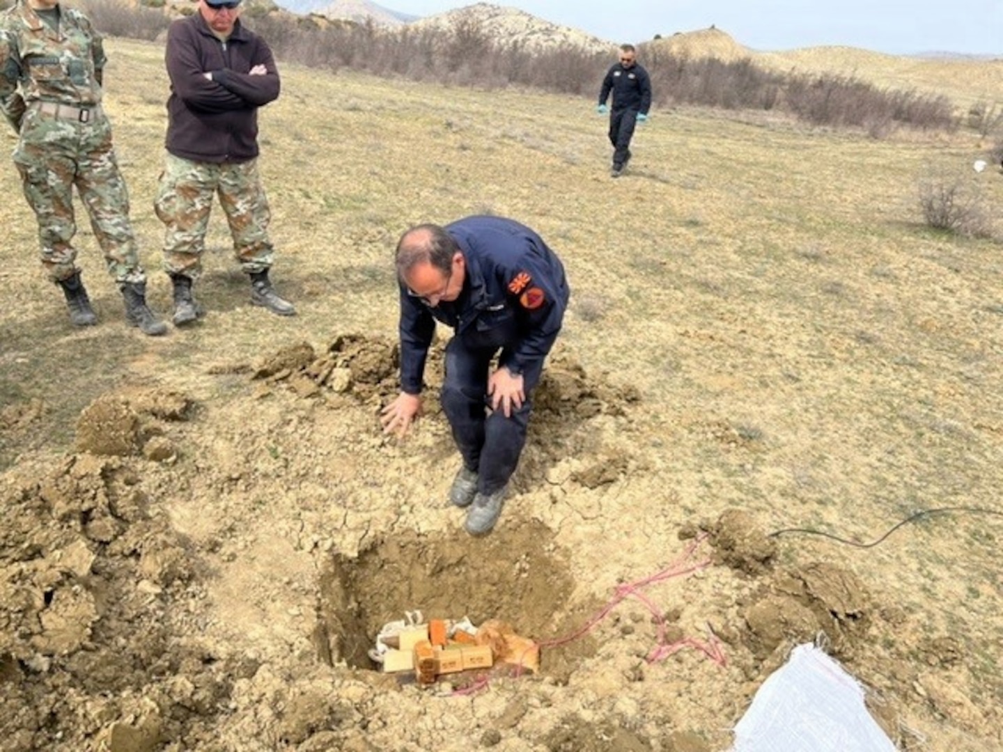 Photo of a senior Explosive Ordnance Disposal technician from North Macedonia’s Protection and Rescue Directorate (PRD) demonstrating the proper ordnance disposal procedures during a partnership event in North Macedonia.