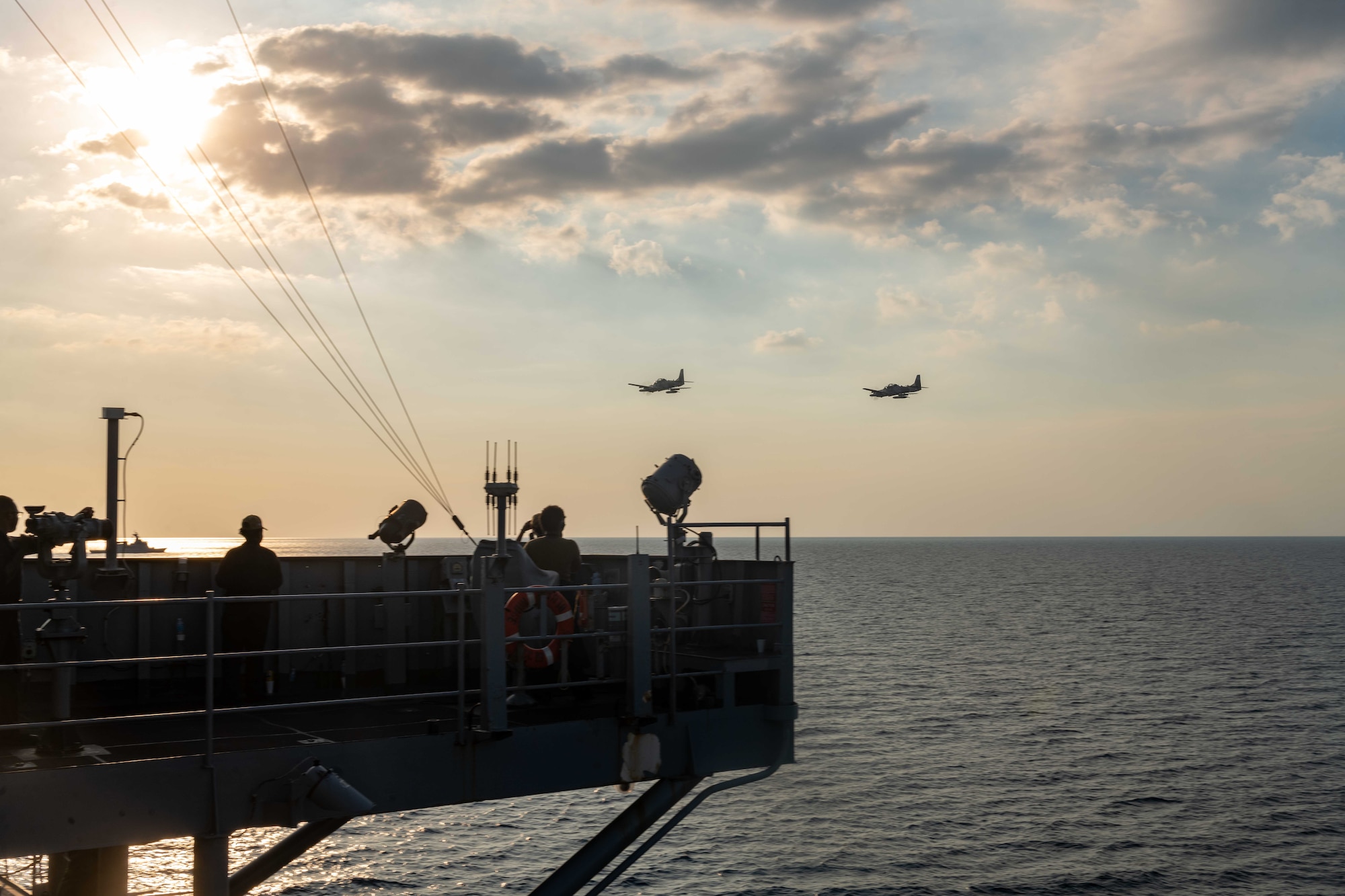Two Armed Forces of the Philippine A-29 Super Tucano light-attack aircraft conduct a flyover of U.S. 7th Fleet flagship USS Blue Ridge (LCC 19) in Manila Bay during the Maritime Cooperative Activity (MCA), March 20, 2026. The U.S. Navy routinely operates with the Armed Forces of the Philippines and partners and allies through MCAs to continually develop, exercise and enhance multi-domain tactical interoperability to uphold peace and security in the region. Blue Ridge and embarked U.S. 7th Fleet staff conduct regular Indo-Pacific patrols to deter aggression, strengthen alliances and partnerships, and advance future warfighting capabilities. (U.S. Navy photo by Mass Communication Specialist Seaman Nicholas Douglass)