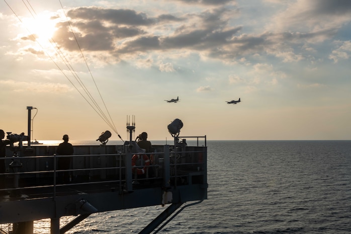 Two Armed Forces of the Philippine A-29 Super Tucano light-attack aircraft conduct a flyover of U.S. 7th Fleet flagship USS Blue Ridge (LCC 19) in Manila Bay during the Maritime Cooperative Activity (MCA), March 20, 2026. The U.S. Navy routinely operates with the Armed Forces of the Philippines and partners and allies through MCAs to continually develop, exercise and enhance multi-domain tactical interoperability to uphold peace and security in the region. Blue Ridge and embarked U.S. 7th Fleet staff conduct regular Indo-Pacific patrols to deter aggression, strengthen alliances and partnerships, and advance future warfighting capabilities. (U.S. Navy photo by Mass Communication Specialist Seaman Nicholas Douglass)