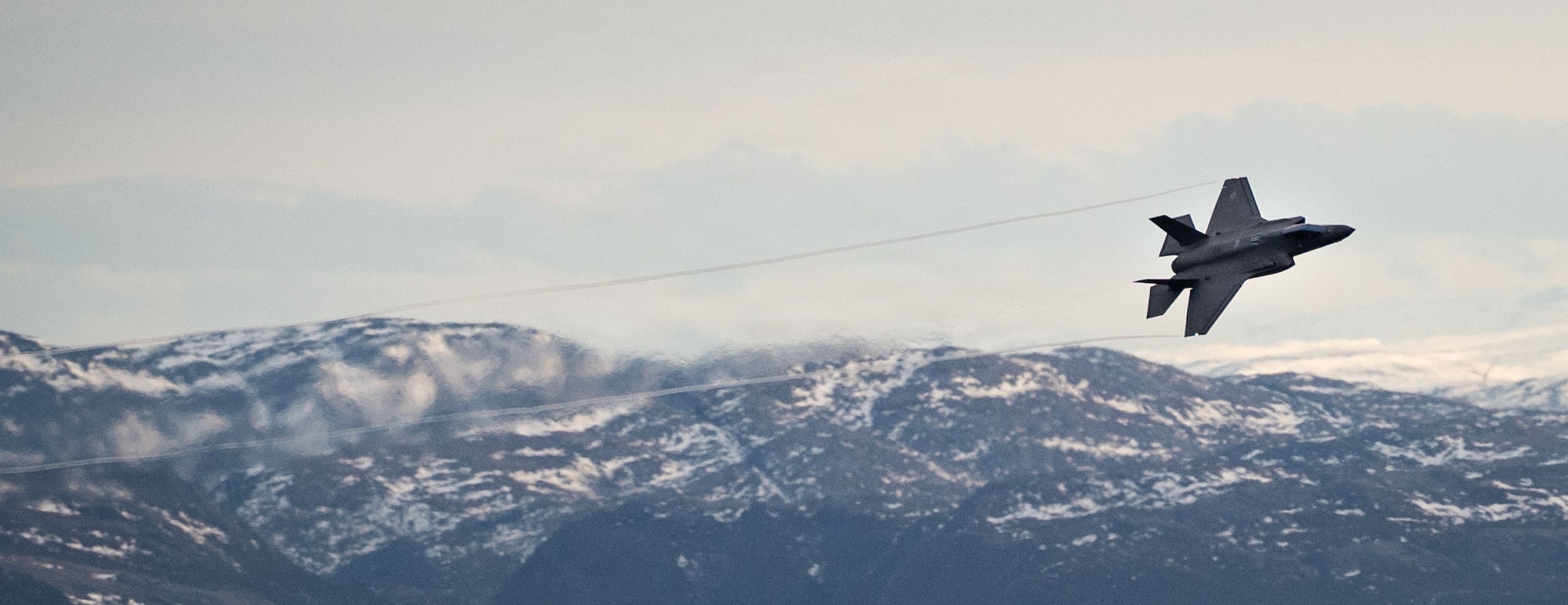 A U.S. Air Force F-35A Lightning II aircraft assigned to the 48th Fighter Wing conducts low level operations during Exercise Cold Response 26 over Kopparen Mountain, Norway, March 17, 2026.