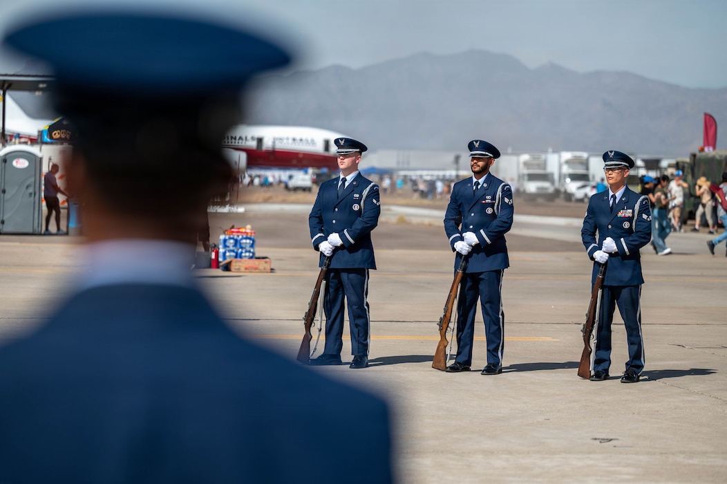 U.S. Air Force Airman 1st Class Timothy Boccia, left, Luke Air Force Base honor guardsman, Senior Airman Roman Bradford, center, Luke AFB honor guardsman, and Senior Airman Paul Snead, right, Luke AFB honor guardsman, conduct a ceremonial performance during the Luke Days 2026 airshow