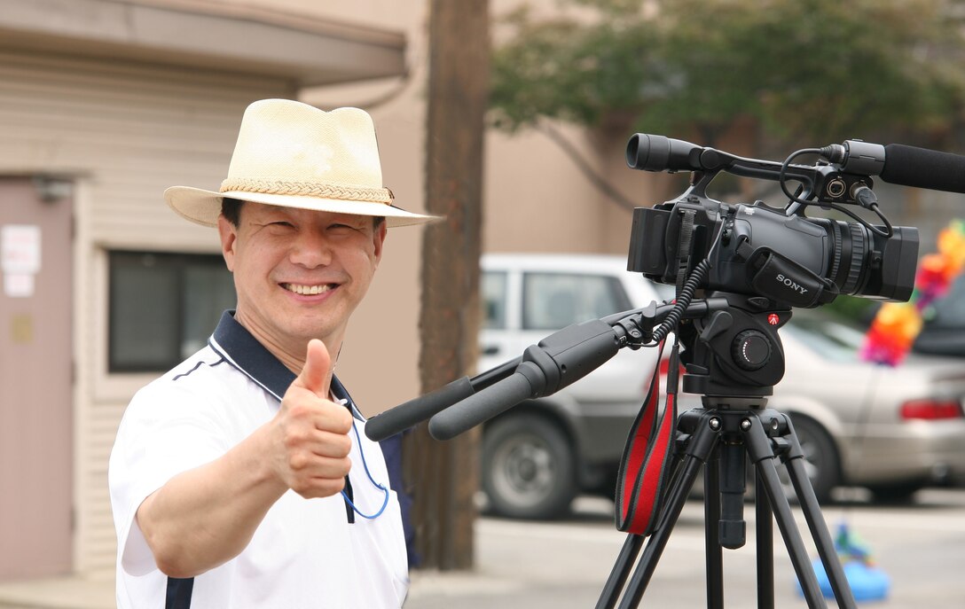 A smile for a career well spent: Visual Information Specialist Yo Kyong-il, who followed in his father’s footsteps into the U.S. Army Corps of Engineers – Far East District in 1985, pauses beside his camera. Now serving alongside his daughter, Mr. Yo retires in March 2026, leaving behind a three-generation family legacy of service to the District. (U.S. Army photo by the U.S. Army Corps of Engineers Far East District)