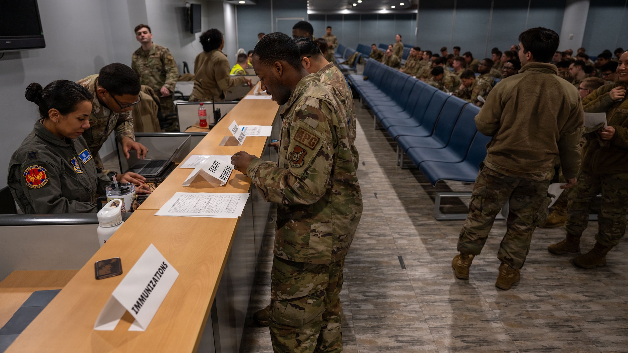 U.S. Air Force Airmen assigned to the 51st Fighter Wing conduct a final inspection with base organizations before leaving to participate in exercise Freedom Shield 26 at Osan Air Base, Republic of Korea, March 6, 2026. The personnel deployment function line ensures members are ready to depart Osan to begin the Agile Combat Employment movement at Kunsan AB, ROK. (U.S. Air Force photo by Senior Airman Rome Bowermaster)