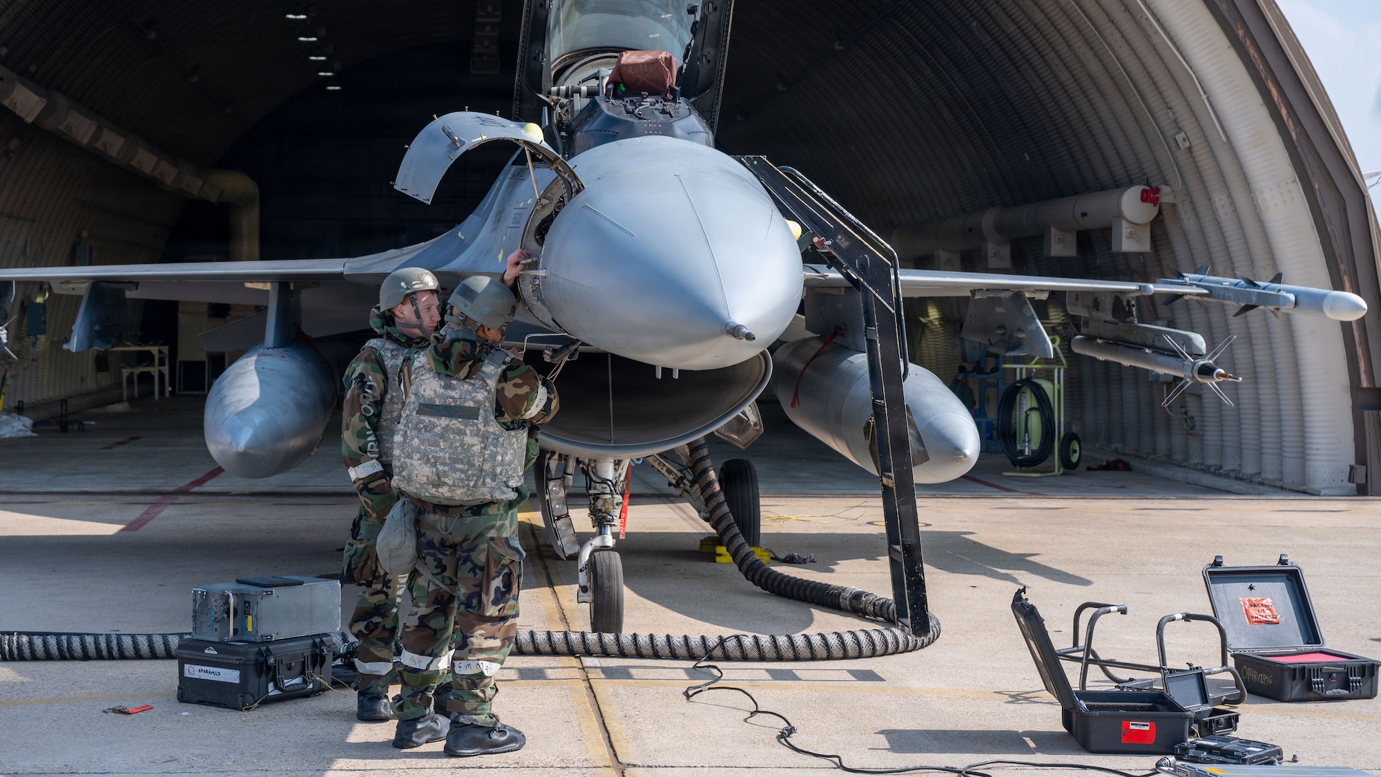 U.S. Air Force Staff Sgt. Cameron Russell, left, and Staff Sgt. John Gegato, both 36th Fighter Generation Squadron F-16 avionics craftsmen, perform maintenance on an F-16 Fighting Falcon during exercise Freedom Shield 26 at Osan Air Base, Republic of Korea, March 10, 2026. The training strengthened coordination between installations while ensuring Airmen can rapidly reposition and continue generating sorties during contingency operations. (U.S. Air Force photo by Senior Airman Rome Bowermaster)