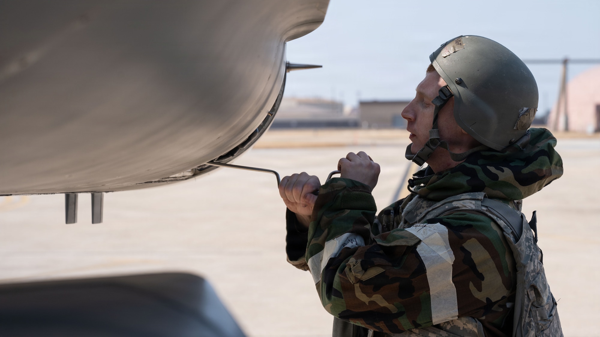 U.S. Air Force Staff Sgt. Cameron Russell, 36th Fighter Generation Squadron F-16 Fighting Falcon avionics craftsman, performs maintenance on an F-16 during exercise Freedom Shield 26 at Osan Air Base, Republic of Korea, March 10, 2026. Training events like Freedom Shield allow U.S. and Republic of Korea forces to strengthen interoperability while preparing for real-world contingencies. (U.S. Air Force photo by Senior Airman Rome Bowermaster)