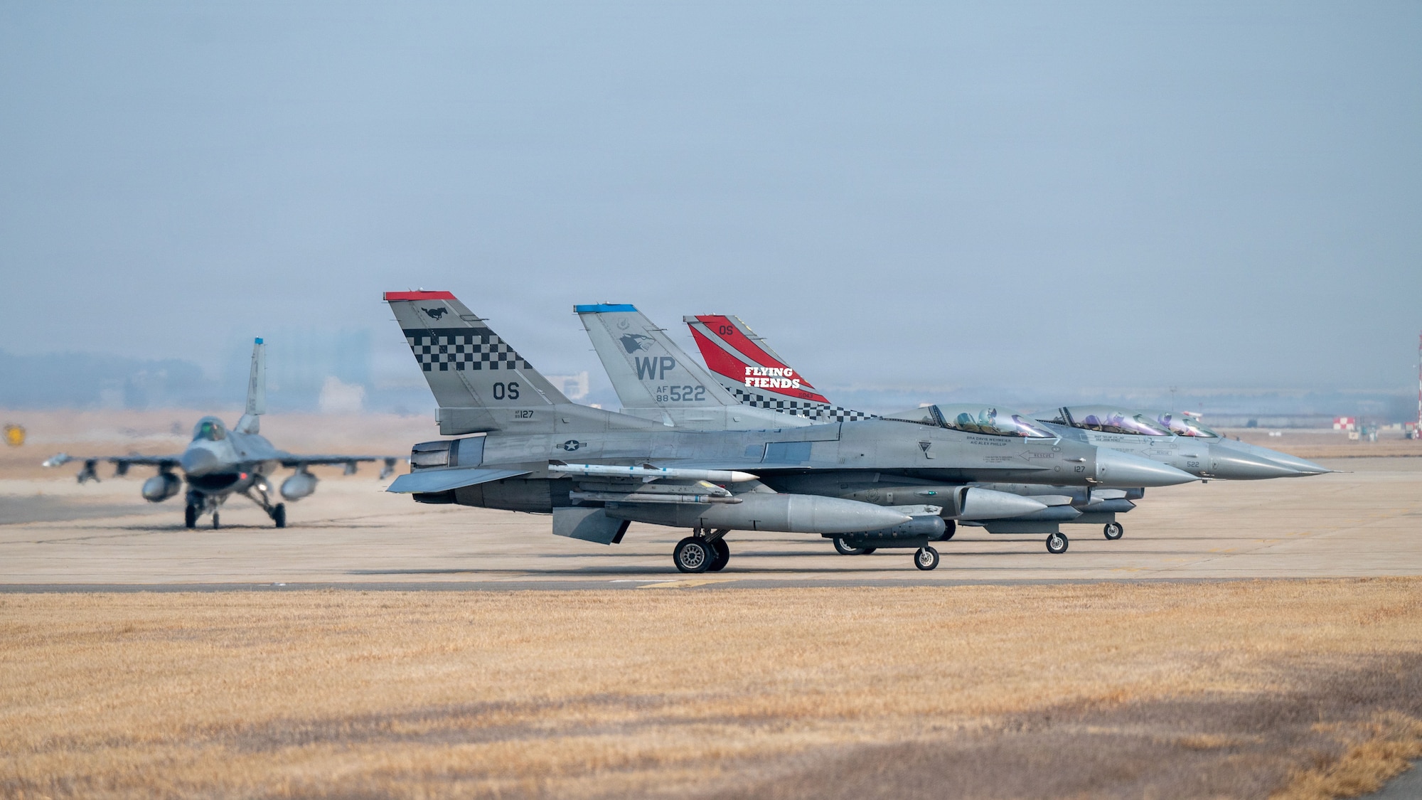 U.S. Air Force F-16 Fighting Falcons prepare for takeoff during exercise Freedom Shield 26 at Osan Air Base, Republic of Korea, March 11, 2026. Airmen practiced generating sorties from a dispersed location to ensure combat airpower can be sustained during potential conflict scenarios. (U.S. Air Force photo by Senior Airman Rome Bowermaster)