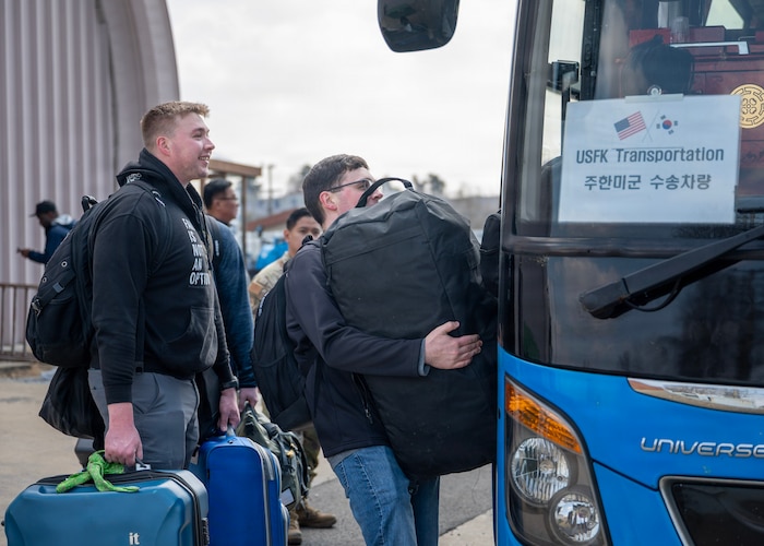 U.S. Air Force Airmen board a bus after Freedom Shield 26 at Osan Air Base, Republic of Korea, March 20, 2026. Ensuring the installation can rapidly receive and sustain additional forces through Rush Park strengthens the Korean Peninsula’s ability to respond quickly if operational needs arise. Osan plays a vital role in maintaining regional stability and supporting the U.S.-ROK Alliance. (U.S. Air Force photo by Staff Sgt. Sarah Williams)