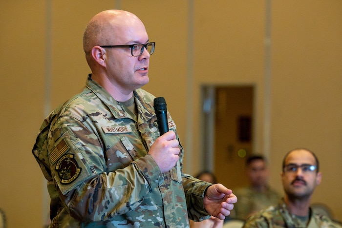 U.S. Air Force Chief Master Sgt. Christopher Whitmore, 14th Fighter Generation Squadron senior enlisted leader, asks panel members a question during a 35th FW open forum town hall at Misawa Air Base, Japan, Feb. 18, 2026.