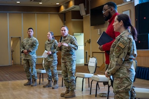 U.S. Air Force Col. Paul Davidson, 35th Fighter Wing (FW) commander, delivers opening remarks with panel members during a 35th FW open forum town hall at Misawa Air Base, Japan, Feb. 18, 2026.