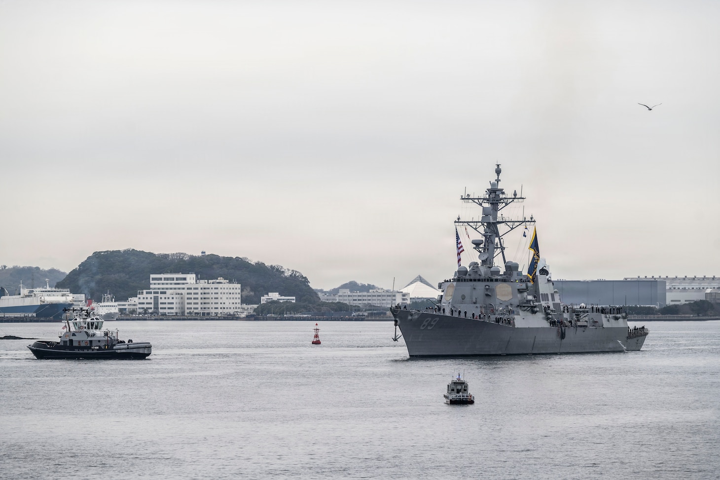 U.S. Navy Arleigh Burke-class guided-missile destroyer USS Mustin (DDG 89) arrives at Commander, Fleet Activities Yokosuka, Japan, March 23, 2026.