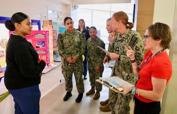 Sailors share their process improvement projects with members of the judging panel during the command process improvement fair at Navy Medicine Readiness and Training Command Twentynine Palms, March 13, 2026. (U.S. Navy photo by Christopher Jones, NMRTC / Naval Hospital Twentynine Palms public affairs officer).