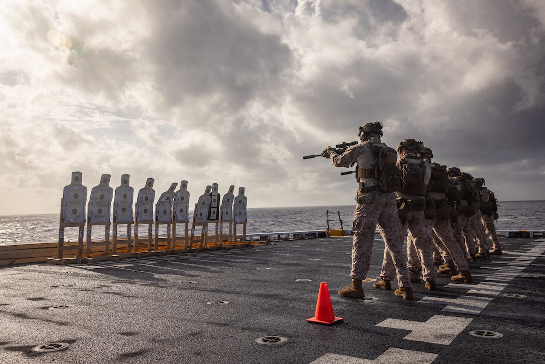 U.S. Marines with India Company, Battalion Landing Team 3/6, 22nd Marine Expeditionary Unit (Special Operations Capable), engage targets during a deck shoot aboard San Antonio-class amphibious transport dock USS Fort Lauderdale (LPD 28) while underway in the Caribbean Sea, March 2, 2026. U.S. military forces are deployed to the Caribbean in support of the U.S. Southern Command mission, Department of War-directed operations, and the president's priorities to disrupt illicit drug trafficking and protect the homeland. (U.S. Marine Corps photo)