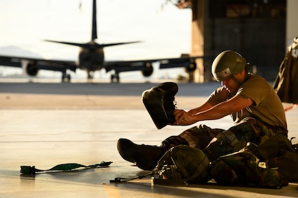 U.S. Air Force Master Sgt. Miguel Munguia, 163rd Aircraft Maintenance Squadron, California Air National Guard, dons mission-oriented protective posture level two gear because of a simulated Chemical, Biological, Radiological and Nuclear threat during the wing’s combat readiness inspection, Exercise Grizzly Talon, at March Air Reserve Base, Calif., March 15, 2026