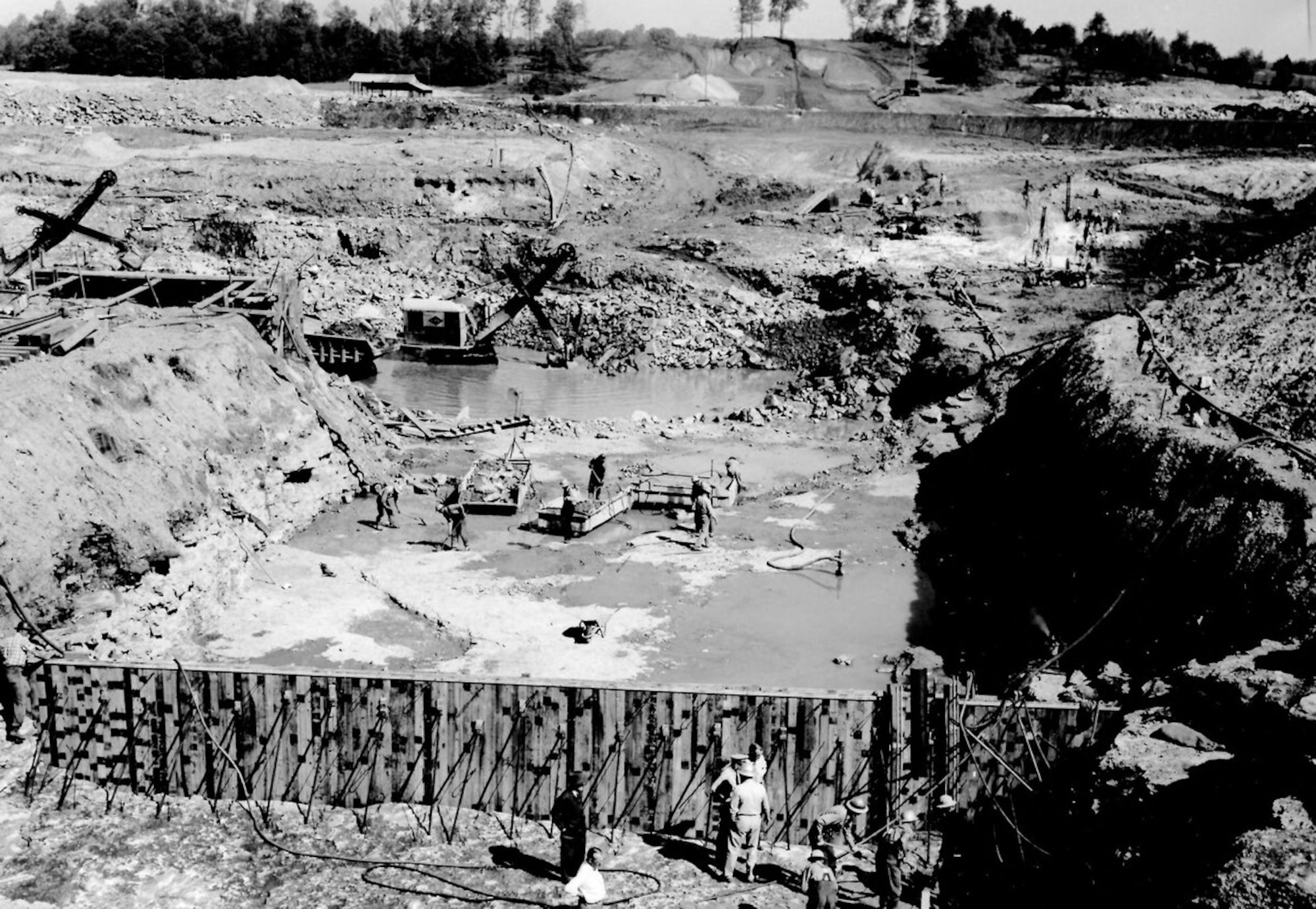 Progress on the spillway section of the Elk River Dam is seen in this photo from May 1951. Work to dam the Elk River began in early 1950. This project was completed in September 1952. The construction of the Elk River Dam created Woods Reservoir, which has since supplied cooling water to the test facilities at Arnold Air Force Base, Tennessee. Arnold AFB is the headquarters of the Arnold Engineering Development Complex. (U.S. Air Force photo)