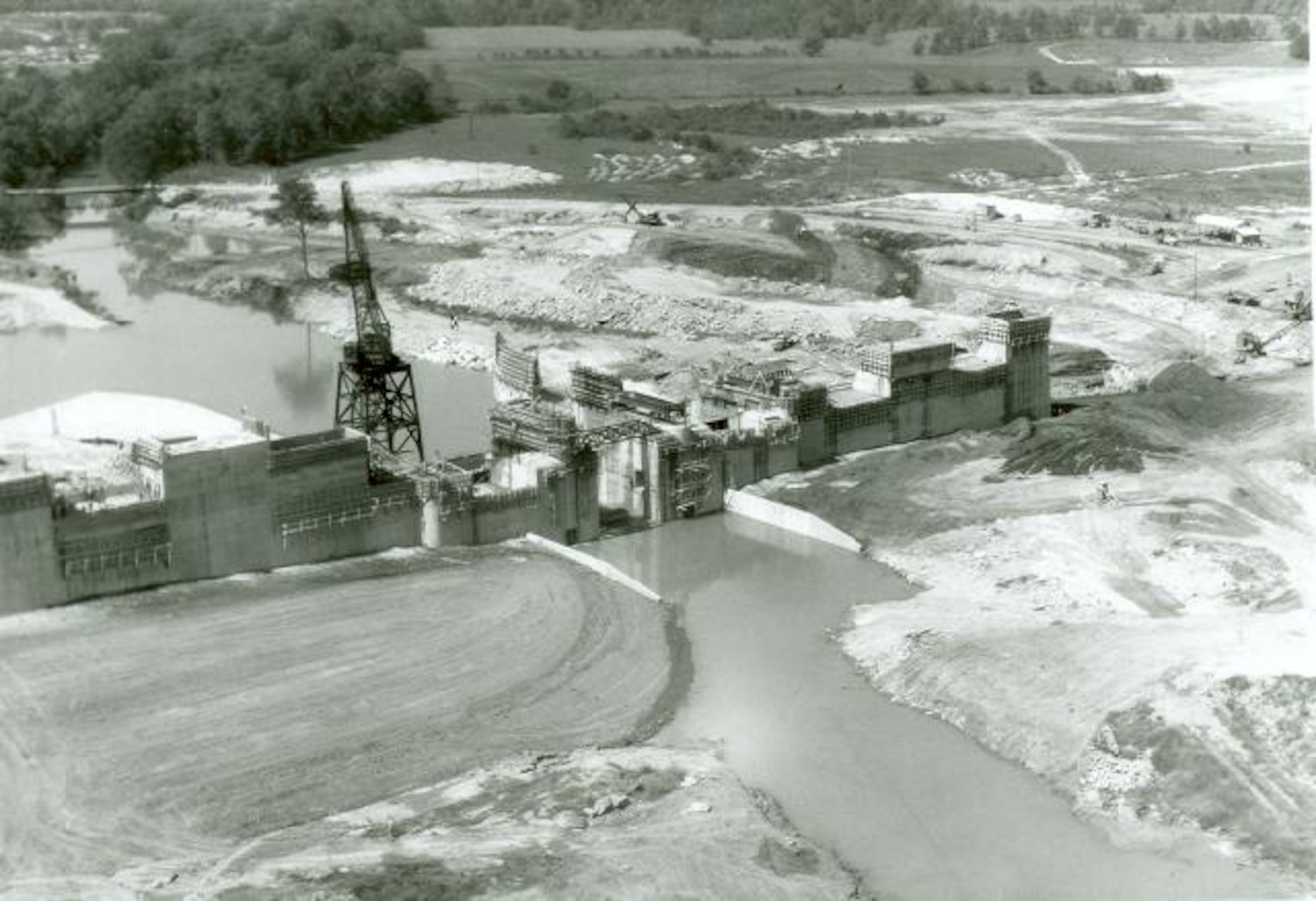 An aerial view of construction on the Elk River Dam is seen in this photo from the 1950s. Work to dam the Elk River began in early 1950. This project was completed in September 1952. The construction of the Elk River Dam created Woods Reservoir, which has since supplied cooling water to the test facilities at Arnold Air Force Base, Tennessee. Arnold AFB is the headquarters of the Arnold Engineering Development Complex. (U.S. Air Force photo)