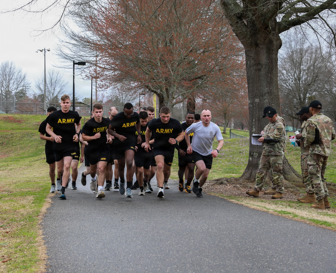 Competitors begin the two-mile run during the Army Fitness Test at the 2026 Georgia Army National Guard State Best Warrior Competition at Central Park in Cumming, Georgia, Mar. 8, 2026. The competition demonstrates the readiness and lethality of the Georgia DoD and country of Georgia Defence Force soldiers by testing the competitors with physical fitness assessments, written exams, and other warrior tasks and battle drills. (U.S. Army National Guard photo by Sgt. 1st Class Brittany Conley)