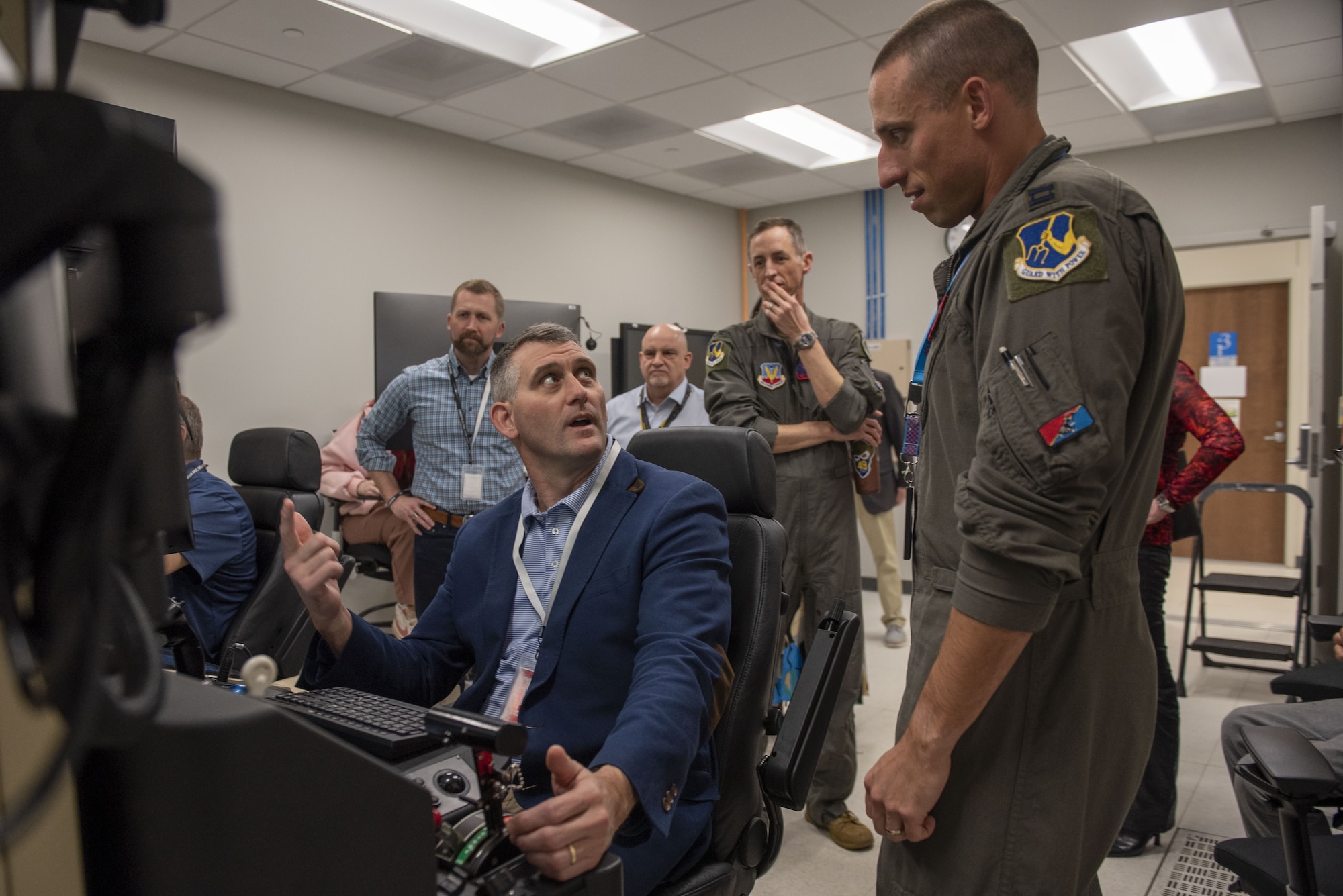 From left, David Merchant, City of Sumter mayor, and U.S. Air Force members assigned to the 25th Attack Wing discuss capabilities of a Ground Control Station simulator at Shaw Air Force Base, S.C., March 9, 2026.