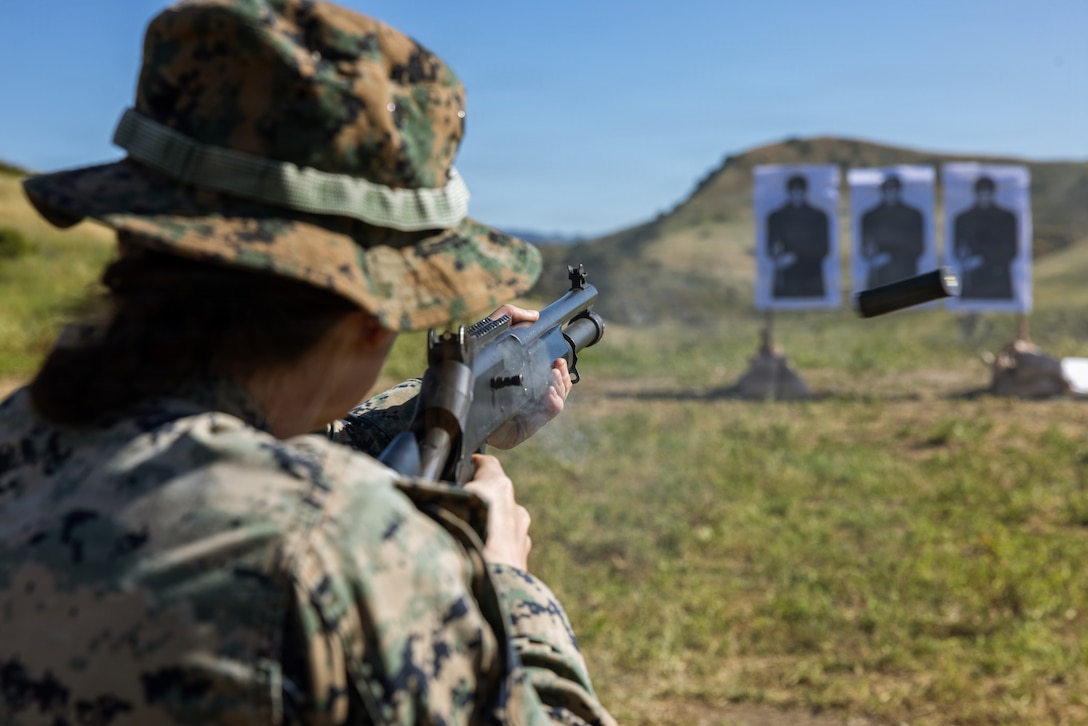 U.S. Marine Corps Cpl. Alena Glumova, a landing support specialist with 1st Distribution Support Battalion, Combat Logistics Regiment 1, 1st Marine Logistics Group, fires an M1014 shotgun during a counter-small unmanned aerial systems shotgun range at Marine Corps Base Camp Pendleton, California, March 18, 2026. The range provided realistic training in countering low-altitude sUAS threats highlighting the necessity to continually adapt to rapidly evolving technologies. (U.S. Marine Corps photo by Lance Cpl. Mhecaela Watts)
