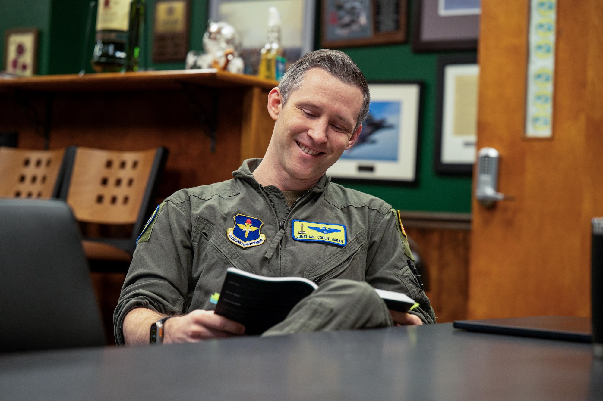 U.S. Air Force Maj. Jonathan Hagan, School of Advanced Air and Space Studies student, studies before a seminar at Maxwell Air Force Base, Alabama, Mar. 23, 2026.