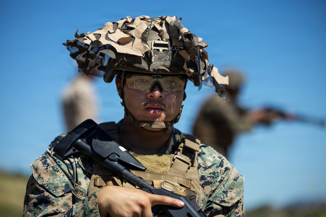 U.S. Marine Corps Cpl. Julio Gutierrezmaldonado, a ground electronics transmission systems maintainer with Combat Logistics Regiment 1, 1st Marine Logistics Group, stands by before firing an M1014 shotgun during a counter-small unmanned aerial systems shotgun range at Marine Corps Base Camp Pendleton, California, March 18, 2026.
