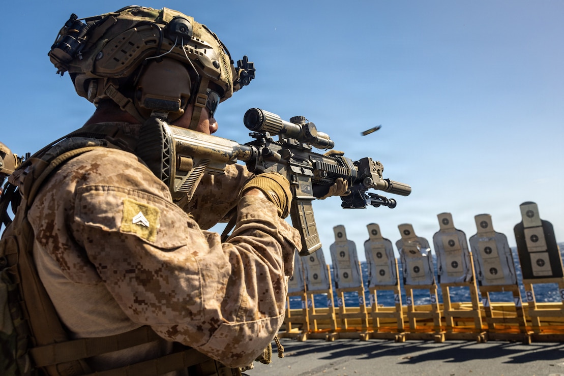 A U.S. Marine with India Company, Battalion Landing Team 3/6, 22nd Marine Expeditionary Unit (Special Operations Capable), engages a target during a deck shoot aboard San Antonio-class amphibious transport dock USS Fort Lauderdale (LPD 28) while underway in the Caribbean Sea, March 2, 2026.