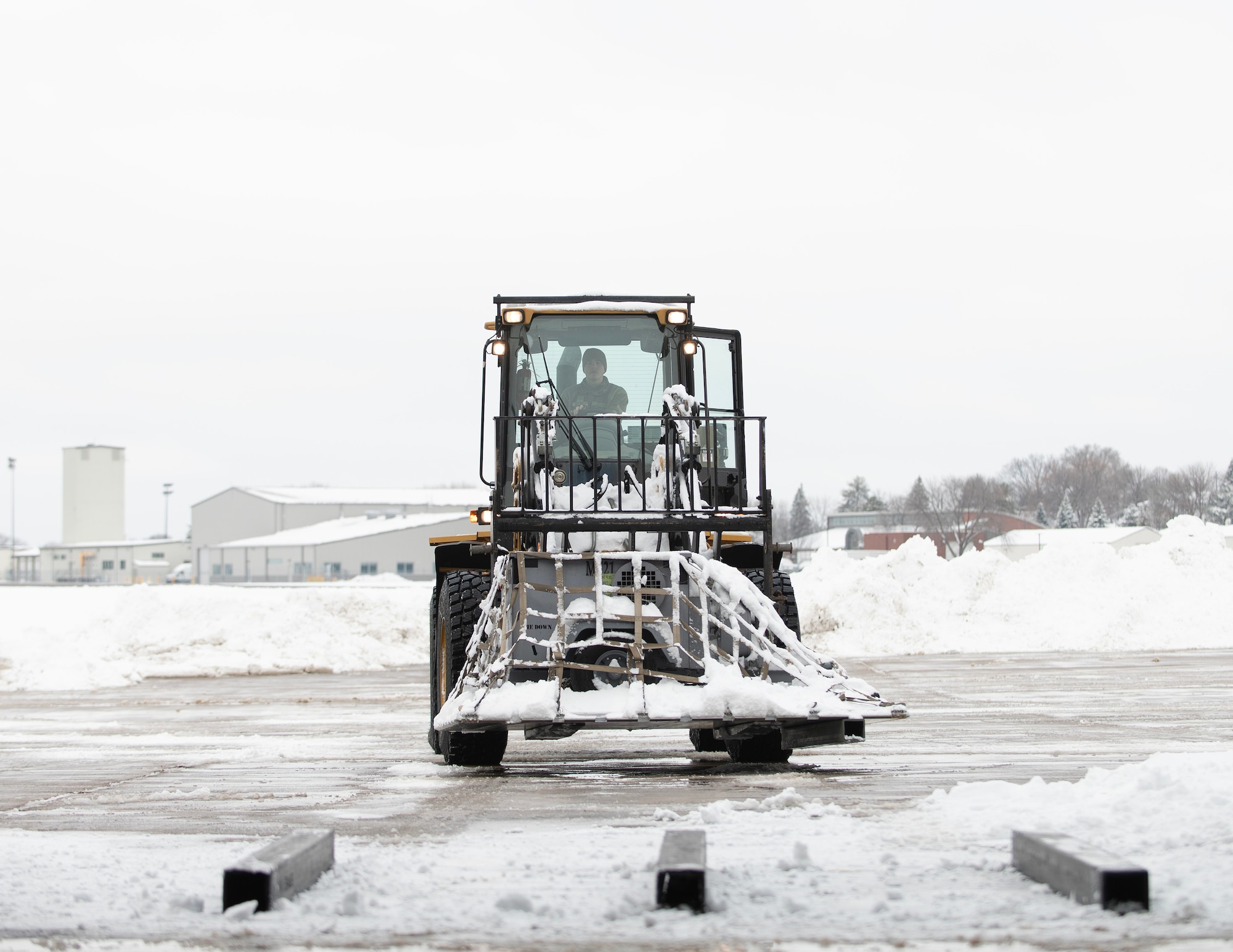 U.S. Air Force Airman 1st Class Cole Kottke, 133rd Air Transportation Function, drives a 10K all-terrain forklift in St. Paul, Minn., Feb. 19, 2026.