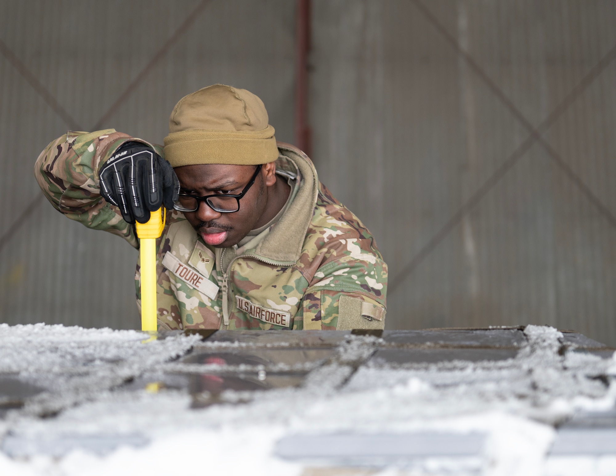 U.S. Air Force Airman 1st Class Doro Toure, 133rd Air Transportation Function, measures the height of equipment in St. Paul, Minn., Feb. 19, 2026