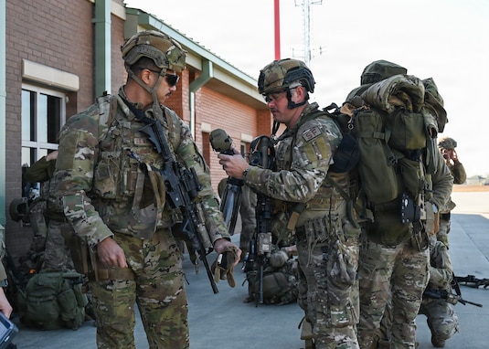 U.S. Airmen assigned to the 165th Security Forces Squadron, 165th Airlift Wing, Georgia Air National Guard, prepare to hot load onto a CH-47 Chinook at the Savannah Air National Guard Base, Georgia, Feb. 6, 2026. This training was part of a wing-wide employment exercise focused on validating 165th Airmen’s readiness to rapidly mobilize and sustain operations in a contested, deployed environment. (U.S. Air National Guard photo by Master Sgt. Morgan R. Whitehouse)