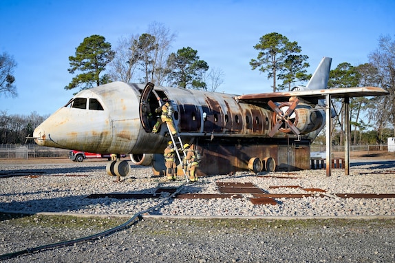U.S. Air Force fire protection specialists, assigned to the 165th Civil Engineer Squadron, 165th Airlift Wing, Georgia Air National Guard, respond to a simulated aircraft fire during an employment exercise at the Savannah Air National Guard Base, Georgia, Feb. 8, 2026. This exercise reinforced technical proficiency to execute aircraft fire response operations in degraded and congested conditions. (U.S. Air National Guard photo by Senior Airman Christa Ross)