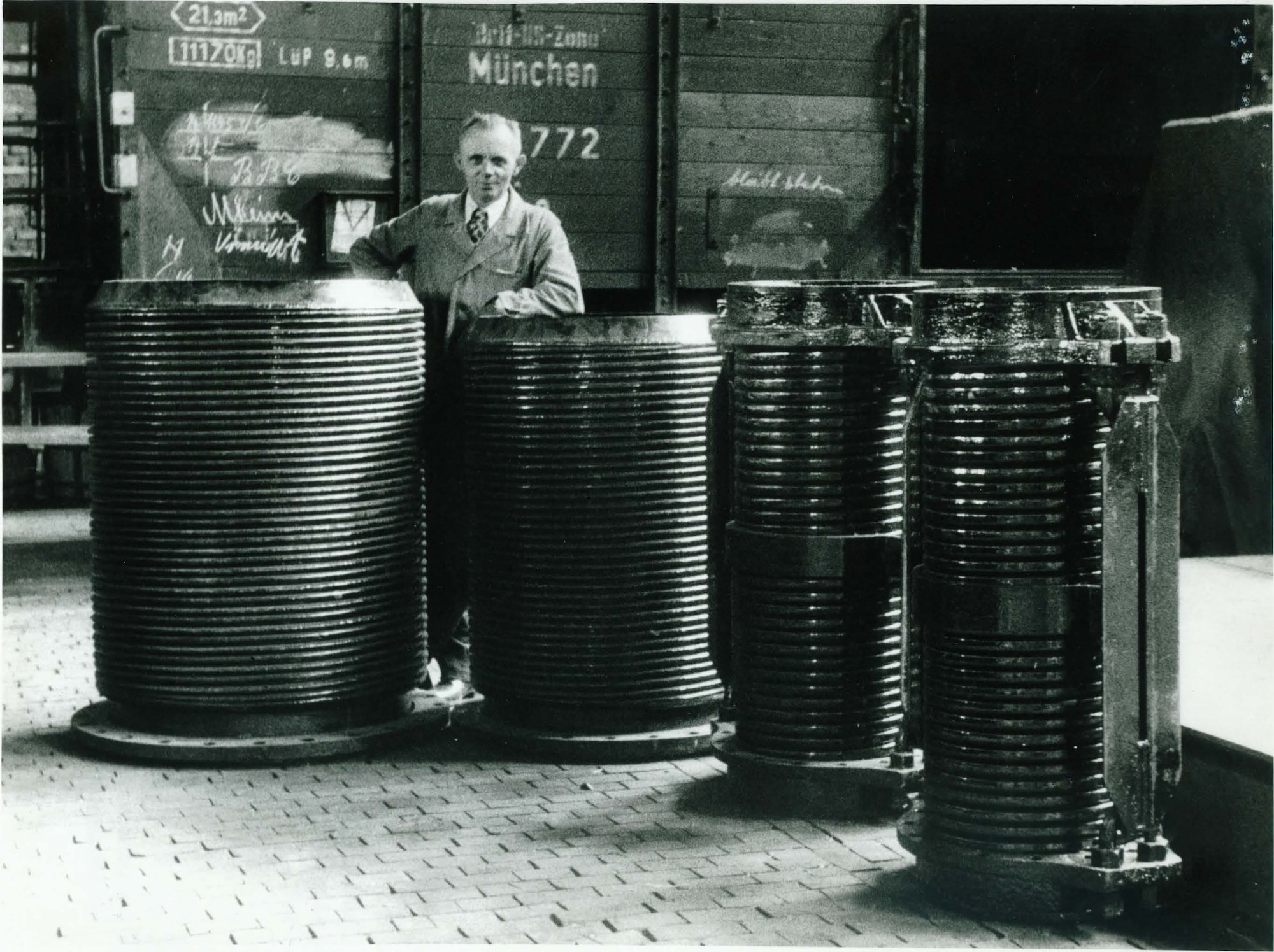 A man stands behind some parts that were captured from the BMW plant in Munich, Germany, at the end of World War II. German test equipment captured after the war was transported to the United States for usage at Arnold Engineering Development Complex and other Air Force facilities. (U.S. Air Force photo)
