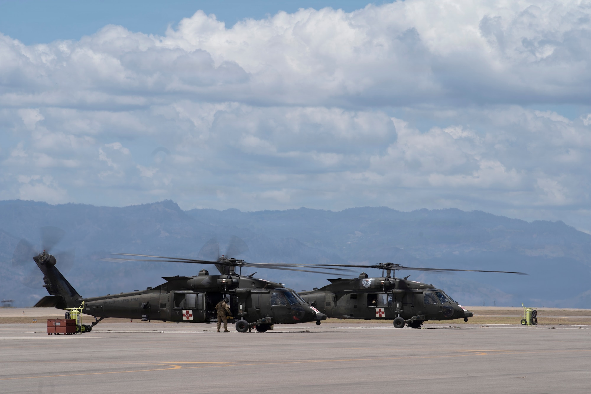 a Photo of two military helicopters.