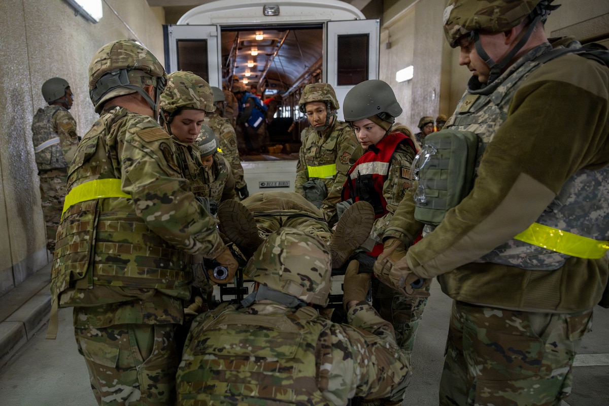 U.S. Airmen assigned to the 35th Medical Group carry a casualty actor out of a medical transport during Freedom Lift in support of Exercise Freedom Shield at Misawa Air Base, Japan, March 10, 2026.